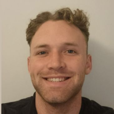 Photo of Ethan smiling. 