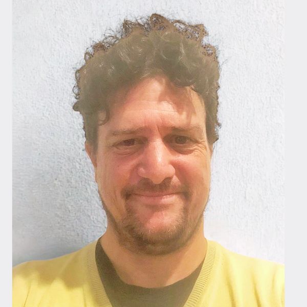 Photo of Tim smiling.
