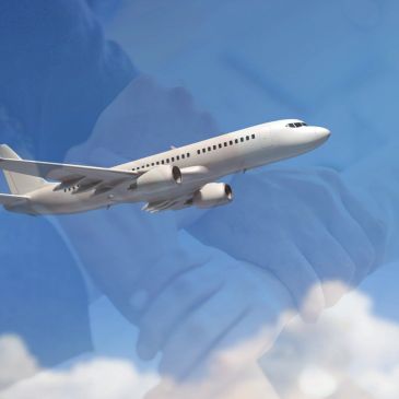 Airplane flying with a background of hands holding each other.