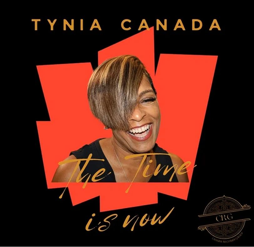 Smiling woman with text 'The Time is Now'.