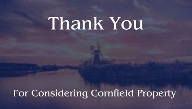 Thank you message over a serene river landscape with windmills at sunset.