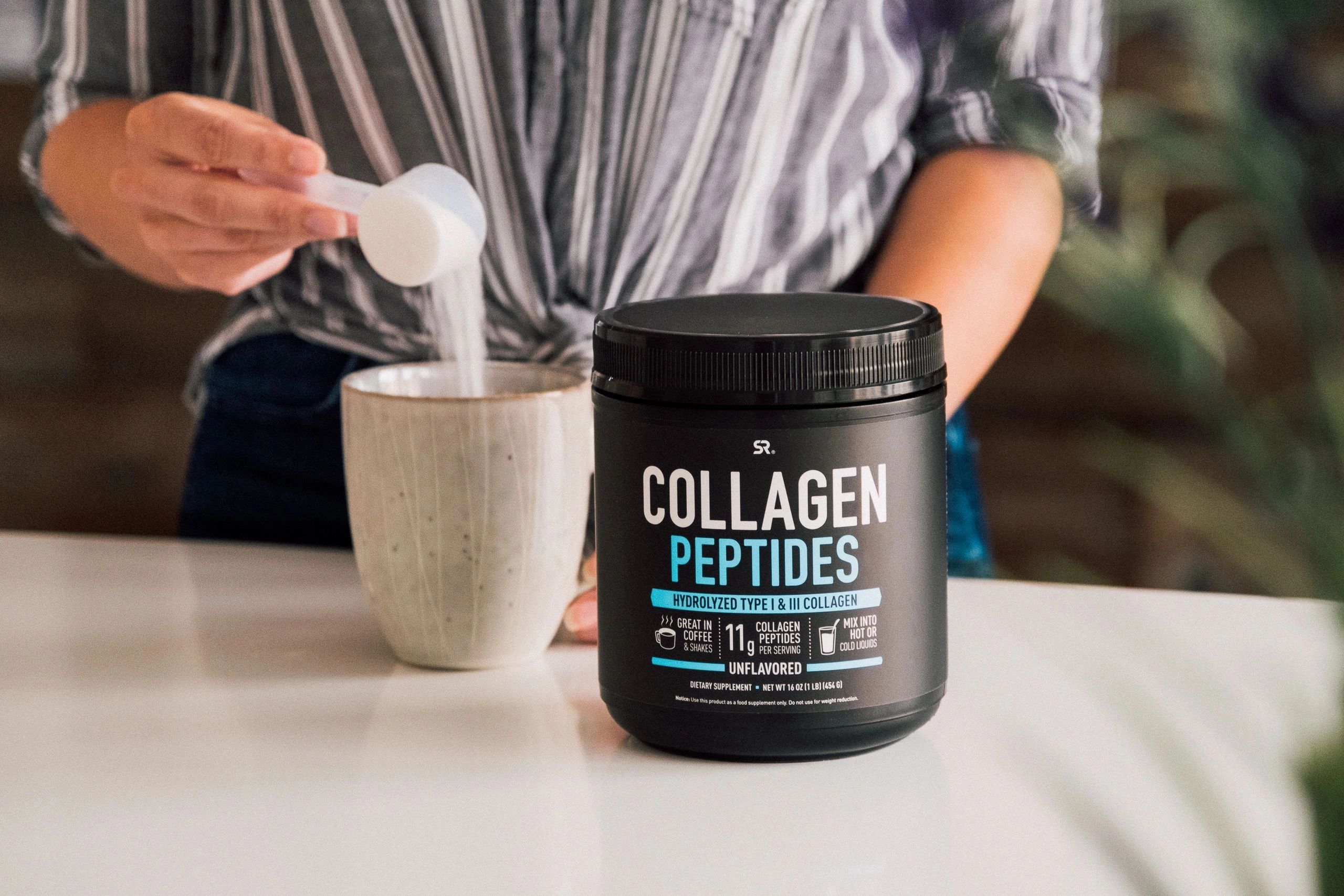 Sports Research packaging design of Collagen Peptides and a girl pouring the powder into a coffee cu