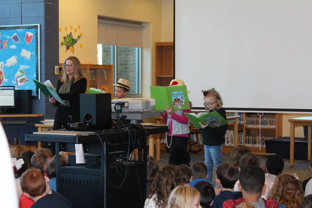 Colleen Dougherty presenting Reader Theater with students during an author visit in Michigan. 
