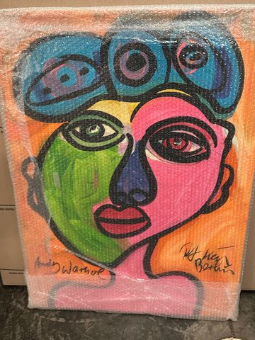 Colorful abstract portrait with bold lines and vibrant hues wrapped in bubble wrap.