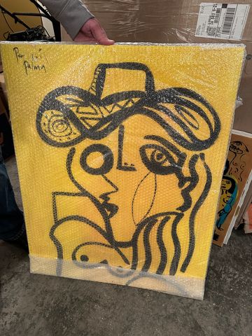 Abstract black line art of two faces on a yellow background, wrapped in bubble wrap.