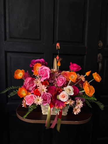 Colorful flower arrangement on a dark background.