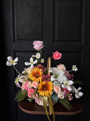 Colorful flower arrangement in a basket.