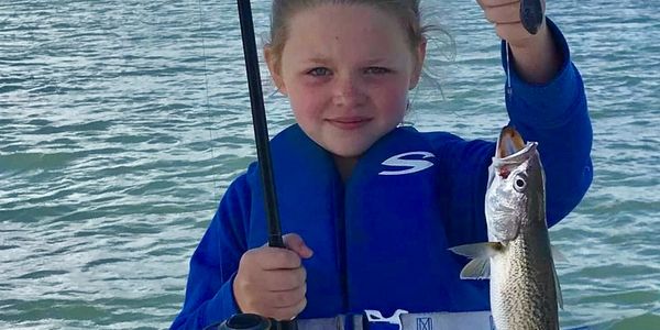 Kids fishing on a charter on the Outer Banks
