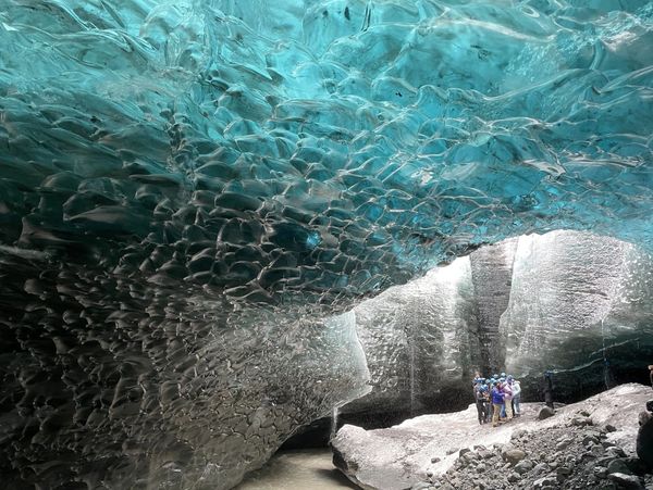 Ice cave within a glacier during a student tour in Iceland.