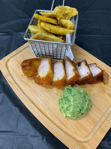 Guacamole, fried green plantins, and fried pork.