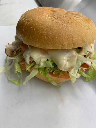 "Fat Turkey" On a kaiser roll turkey, bacon, mozzarella cheese, lettuce and tomato.