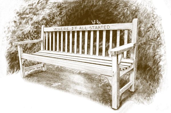 Two birds sit on a wooden bench, with the phrase "Where It All Started" carved into the backrest.