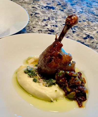 Gourmet duck leg with creamy puree and vegetable relish.