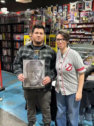 comic artist, portrait artist Jessica archer artworks with fans at Gotham Central comics comic shop