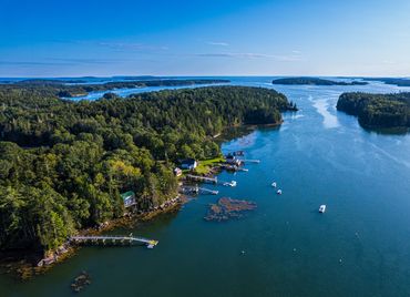 Houses and piers along the water in midcoast Maine
