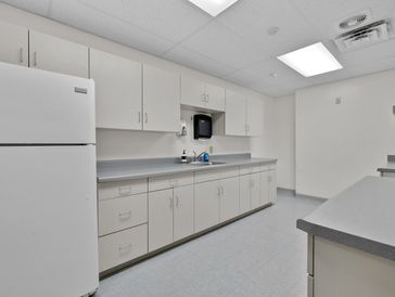 Common area break room with refrigerator and microwave