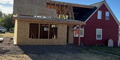 House extension under construction with wooden framework.