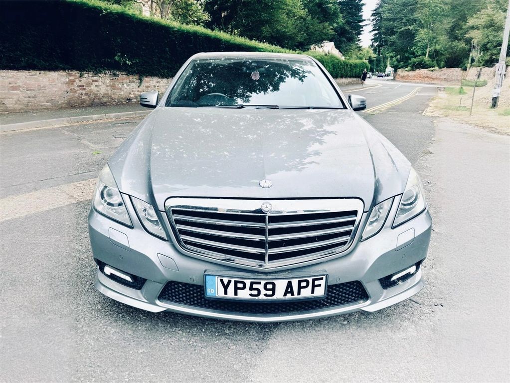 Front view of a silver Mercedes-Benz car.