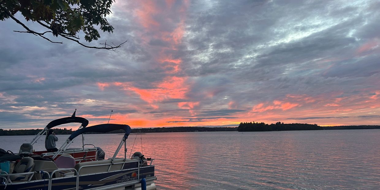 A boat floating on Pushaw Lake