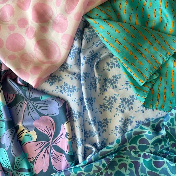 Colorful patterned fabrics with floral and abstract designs.