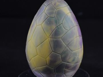 Breakable cracked dinosaur egg.  Chocolate. 