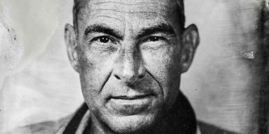 Black and white portrait of an older man.