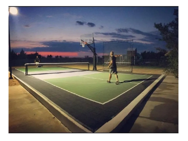 A happy customer in North Texas enjoys pickleball at nights.