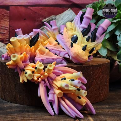 Colorful handcrafted coral reef decorations with vibrant pink, yellow, and black accents.