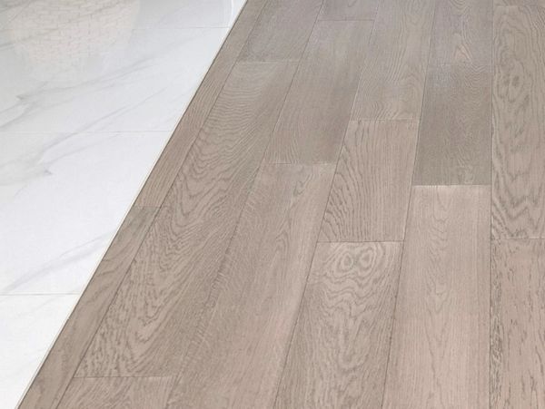 Modern custom tile and hardwood flooring remodel in a custom built home in Tiny Township Ontario.