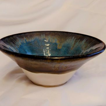 Ceramic bowl with blue and brown glaze.