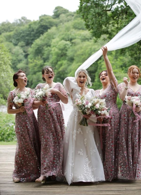 Bridal makeup on Bride with four bridesmaids, Bride's veil blowing in the wind