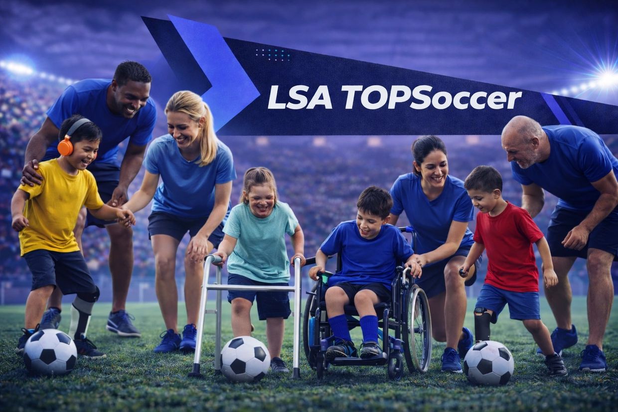 Children with disabilities playing soccer with supportive adults on a field.