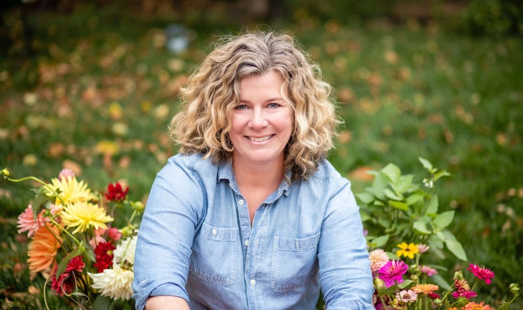 A scenic landscape featuring mountains, a river, and a clear blue sky.