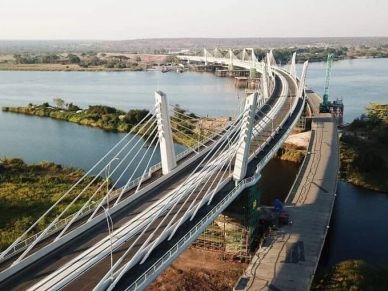 A modern cable-stayed bridge over a river.