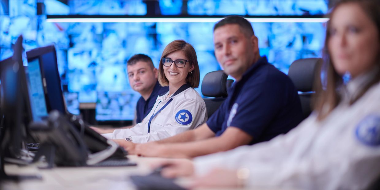 Security team monitoring surveillance screens.