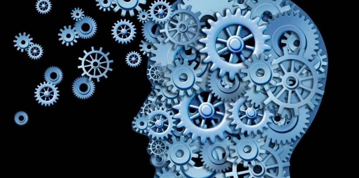 Human head made of interconnected blue gears.