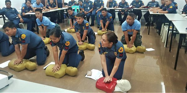 PNP personnels performing CPR during a Basic Life Support training