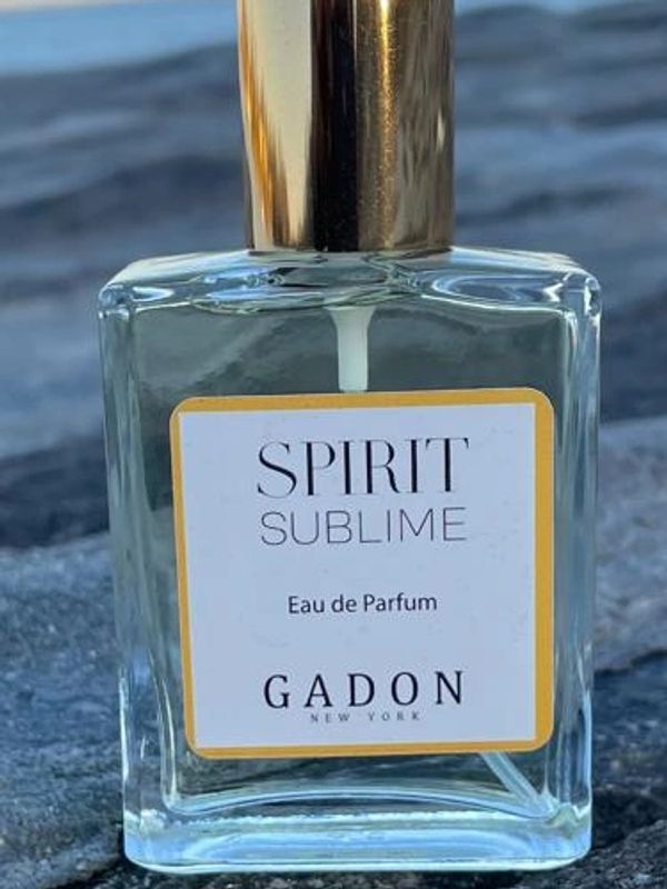 Spirit Sublime Eau de Parfum bottle on a rock