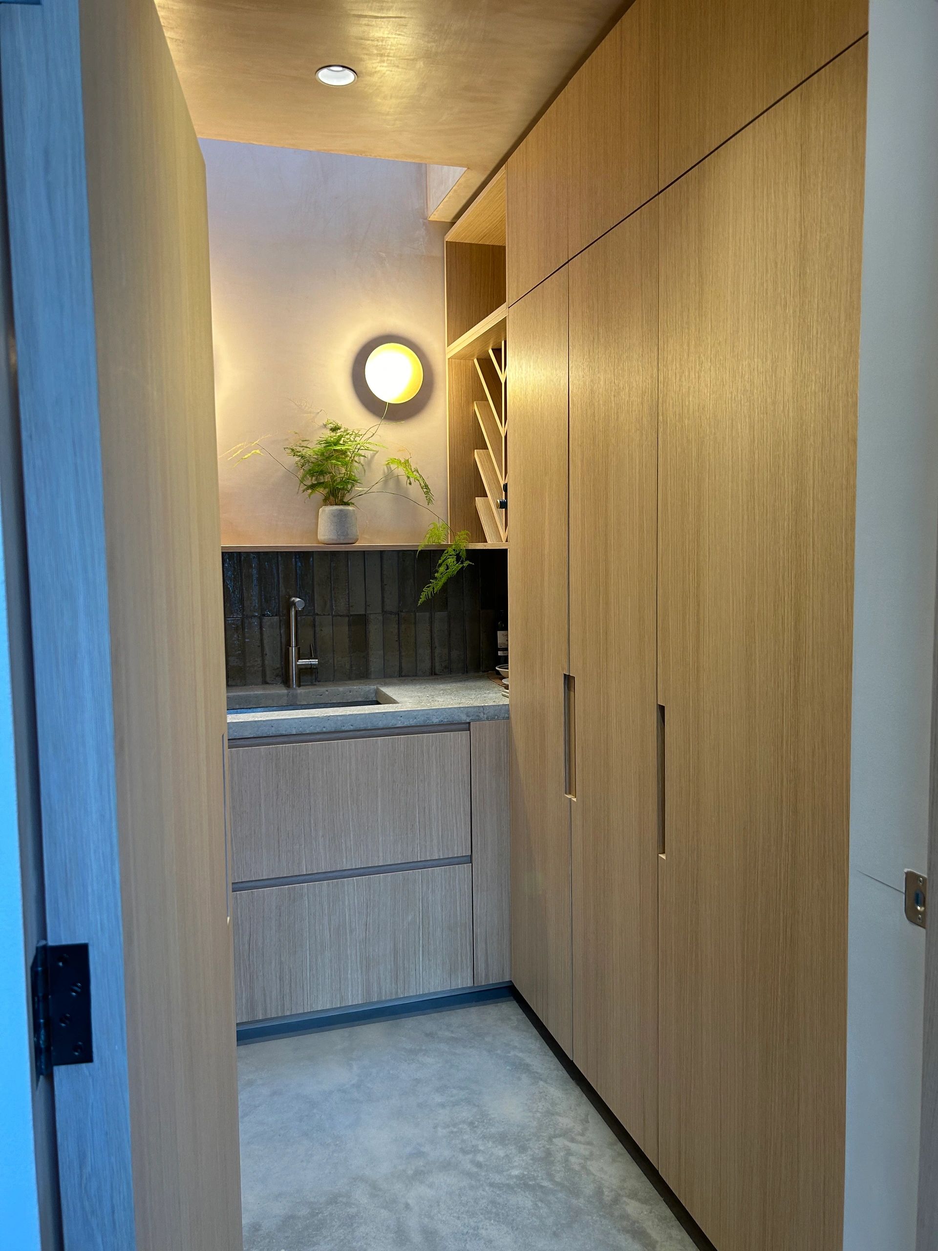 Bespoke cabinetry. Oak handle-less doors. Ikea custom oak drawer fronts