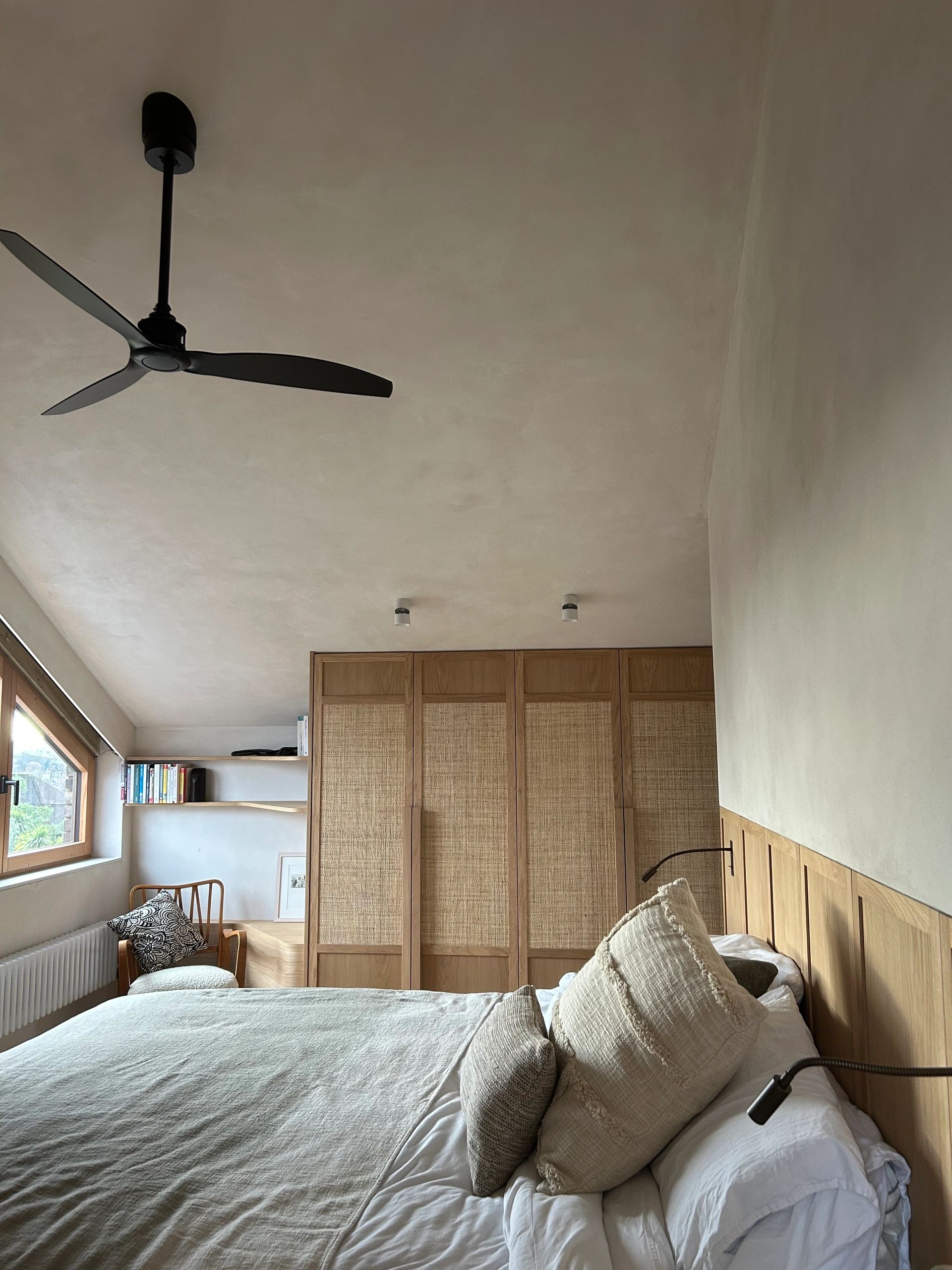Bespoke oak wardrobe fronts. Oak veneer, solid oak. Rattan & custom oak handle. Floating bed