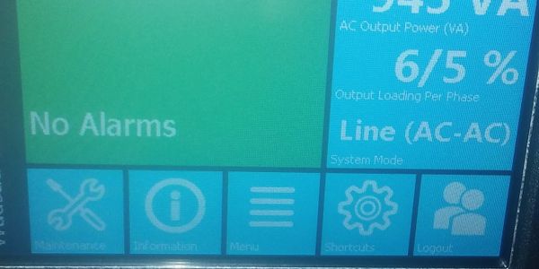 Device screen showing no alarms and system status icons.