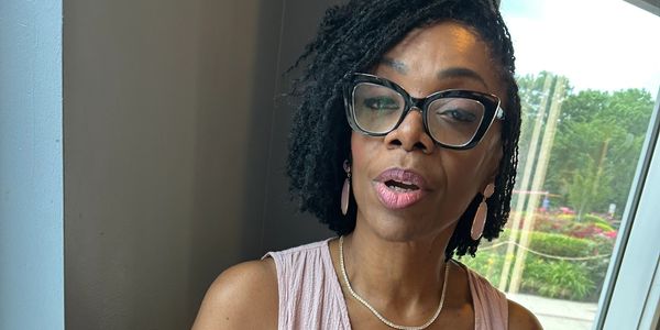 Woman wearing eyeglass and looking a head