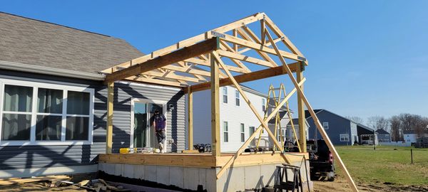 Rough framing of and outdoor living space on a new foundation. 