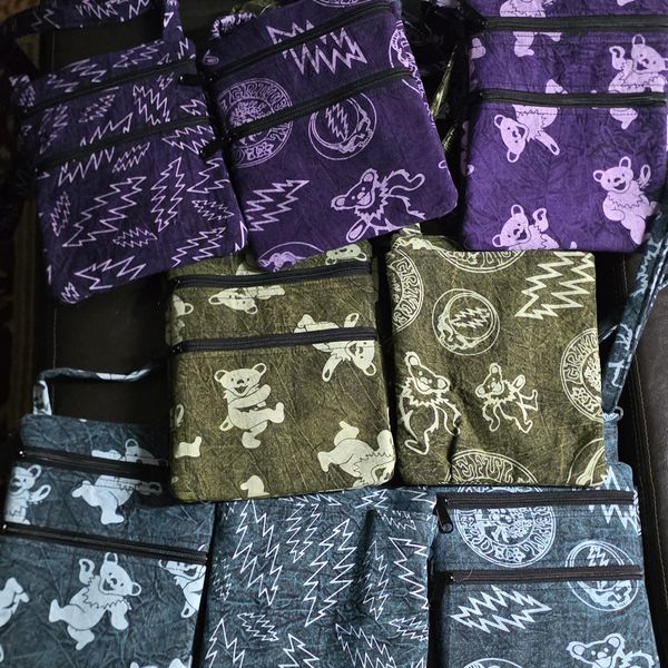 Deadhead images on crossbody bags in purple, green and blue. Handmade one of a kind