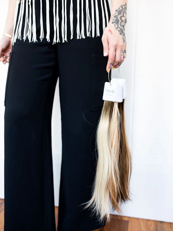 Person holding hair color samples