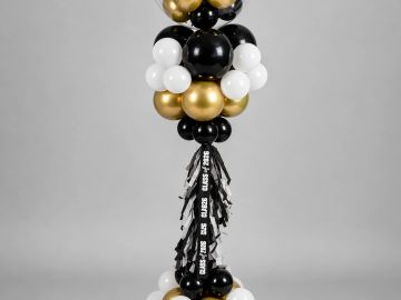Elegant black, white, and gold balloon tower decoration.