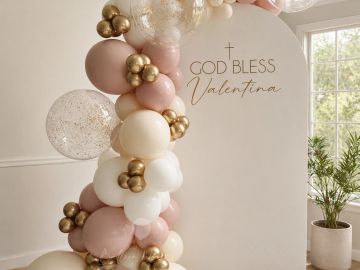 Balloon decoration with "God Bless Valentina" sign.