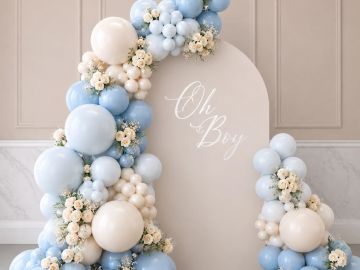 Blue and white balloon arrangement with 'Oh Boy' sign.