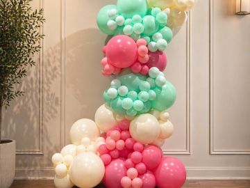 Colorful balloon column decoration indoors.