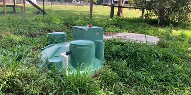 AWTS and septic tank in background